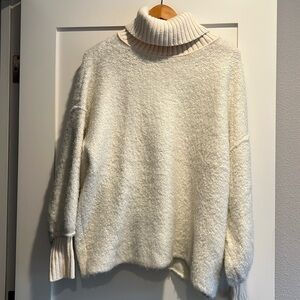 FREE PEOPLE oversized soft sweater cream colored size XS.  Great condition.